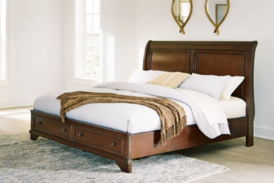 Ashley Furniture Trellington Sleigh Storage Bed with elegant wooden frame and built-in storage drawers in a classic sleigh design.