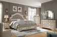 Ashley Furniture Realyn bedroom set featuring a bed, nightstands, and dresser with elegant wood finish and classic design.
