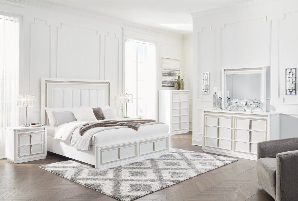 Ashley Furniture Chalanna bedroom set featuring a bed, nightstands, and dresser with modern design and LED lighting in a stylish bedroom.