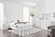 Ashley Furniture Chalanna bedroom set with bed frame, nightstands, and LED lighting, featuring modern design and neutral finish.