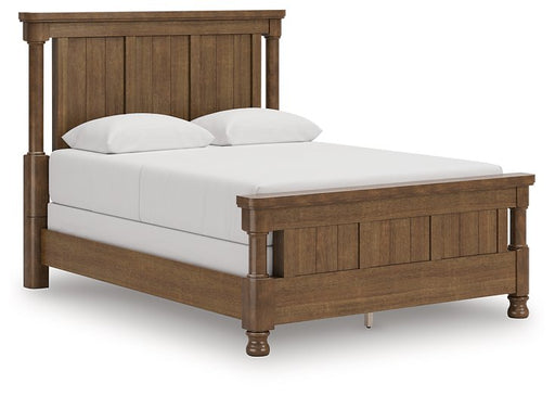 Ashley Furniture Rowlenstown Bed with a stylish wood finish, shown from an angled side view in a well-lit bedroom setting.