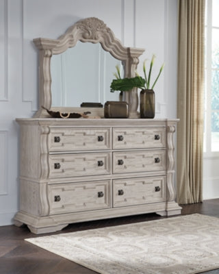 Ashley Furniture Bruchandi bedroom set featuring a bed, nightstands, and dresser with elegant wood finish.