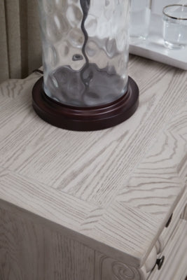 Close-up of Ashley Furniture Bruchandi bedroom set with detailed wood finish and elegant design elements.