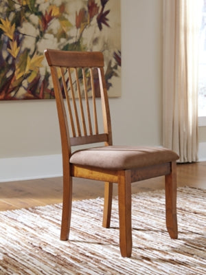 Ashley Furniture Berringer dining chair with wooden legs and upholstered seat, shown in a stylish dining room setting.