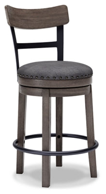 Ashley Furniture Caitbrook counter height bar stool with wooden legs and upholstered seat, shown from an angled side view.