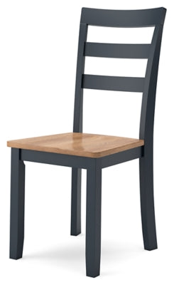 Ashley Furniture Gesthaven dining room set with a wooden table and chairs, shown from an angled side view.
