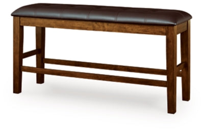 Ashley Furniture Ralene counter height dining bench with wooden legs and upholstered seat, angled view.