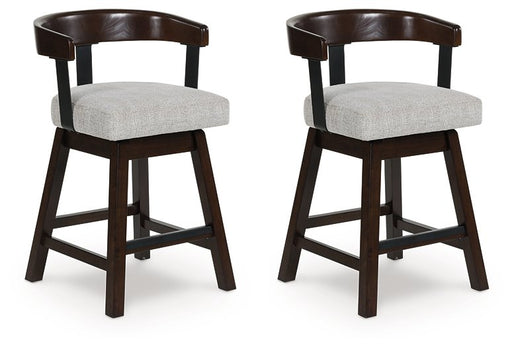 Two Ashley Furniture Haddigan counter height barstools with wooden legs and upholstered seats, shown from an angled side view.