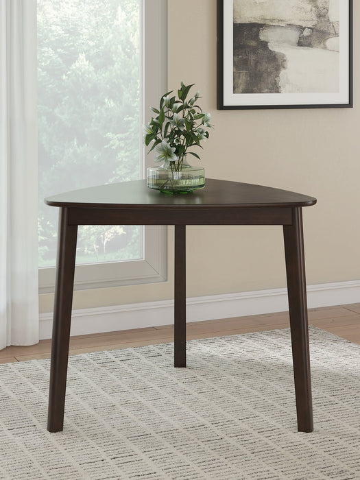 Ashley Furniture Mallenette dining table with a dark wood finish and modern design, shown in a stylish dining room setting.