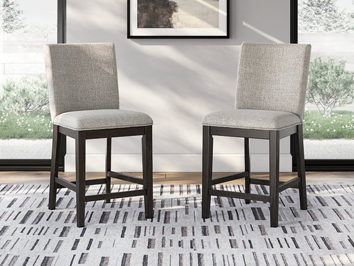 Ashley Furniture Neymorton counter height barstool with wooden legs and upholstered seat, shown from a front angle.