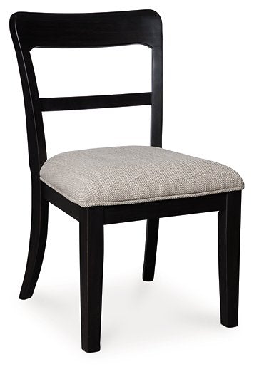 Ashley Furniture Greddinton dining chair with dark wood finish and upholstered seat, shown from a side angle.