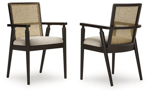 Ashley Furniture Galliden dining arm chair with upholstered seat and wooden frame, shown from an angled view.