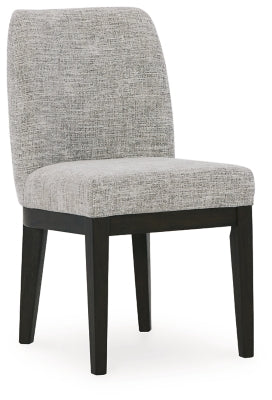 Ashley Furniture Burkhaus dining room set with a wooden table and matching chairs, shown from an angled side view.
