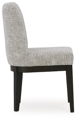 Ashley Furniture Burkhaus dining room set with a wooden table and matching chairs, shown from a side angle in a modern dining space.