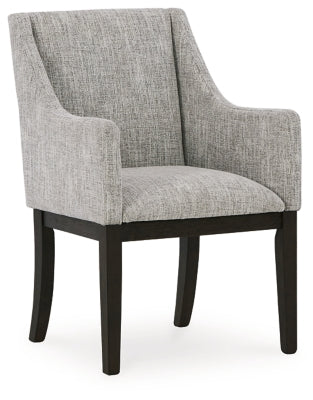 Ashley Furniture dining room set with table and six upholstered chairs, shown from an angled side view in a modern dining space.