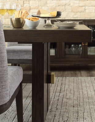 Detailed view of Ashley Furniture Burkhaus dining room set base, showcasing the sturdy wood legs and elegant design.