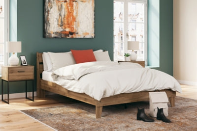 Ashley Furniture Deanlow Bed with a wooden frame and headboard, showcasing a modern bedroom design.