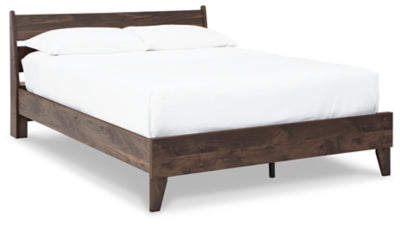 Ashley Furniture Calverson Bed shown from a side angle with a modern design and dark wood finish.