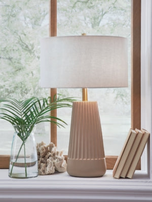 Ashley Furniture Dellner table lamp with a modern design, featuring a sleek base and a fabric shade, ideal for living room decor.