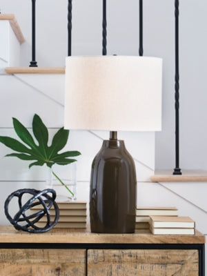 Ashley Furniture Jyler table lamp with a sleek ceramic base and fabric shade, ideal for modern living room or bedside decor.