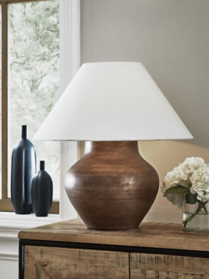 Ashley Furniture Whitham table lamp with a classic design, featuring a beige fabric shade and a sturdy base.