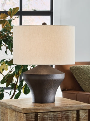 Dolanham table lamp by Ashley Furniture featuring a stylish base and fabric shade, perfect for bedside or living room decor.