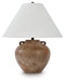Ashley Furniture Ferrilby table lamp with a sleek base and fabric shade, perfect for adding style to a living space.