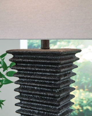 Ashley Furniture Golzar table lamp with a sleek base and fabric shade, ideal for modern living room or bedside lighting.