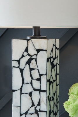 Ashley Furniture Macaria table lamp with a sleek base and fabric shade, ideal for living room or bedside lighting.