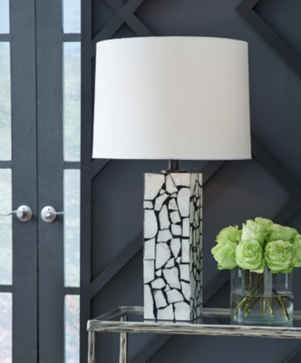 Ashley Furniture Macaria table lamp with a sleek design and fabric shade, perfect for bedroom or living room decor.