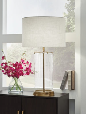 Ashley Furniture Gizeh Table Lamp with a sleek ceramic base and fabric shade, perfect for modern home decor.