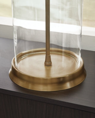 Close-up of the Gizeh Table Lamp base by Ashley Furniture, featuring a modern design with a smooth finish and elegant details.