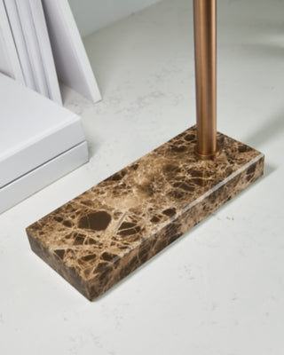 Close-up of Ashley Furniture Yafe Desk Lamp base showing intricate design and brushed metal finish on a table lamp.