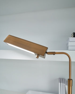 Close-up of the Yafe Desk Lamp by Ashley Furniture, showing its sleek table lamp design with a modern finish and detailed base.