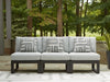 Ashley Furniture Beachloft outdoor sectional with beige cushions and woven rattan frame, designed for patio lounging.