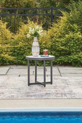 Outdoor end table from Ashley Furniture's Ocean Beach collection, featuring a weathered wood finish and sturdy design.