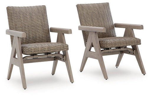 Set of two Ashley Furniture outdoor rocking arm chairs with wooden frames and woven seats, ideal for patio dining or relaxing outside.