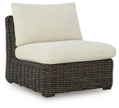 Ashley Furniture Kimora outdoor sectional with plush cushions and wicker frame, ideal for patio or garden seating.