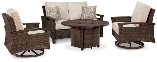 Outdoor table set with Ashley Furniture Paradise Trail loveseat, lounge chairs, and fire pit table on a patio.