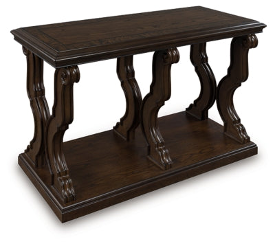 Ashley Furniture Maylee Sofa Table with a sleek wood finish, shown from an angled side view.
