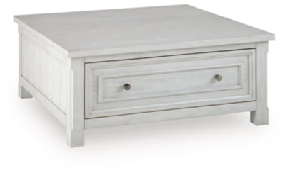 Ashley Furniture Robbinsdale lift-top coffee table with angled closed position, showcasing its sleek design and storage space.