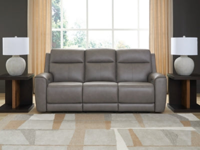 Ashley Furniture 5Z-Comfort Power Reclining Sofa in neutral fabric with plush cushions and modern design, shown in a close-up shot.