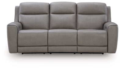 Ashley Furniture 5Z-Comfort Power Reclining Sofa with plush cushions and reclining features, shown from a head-on view.