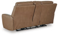 Ashley Furniture DeepWakes power reclining loveseat with console, showing plush cushions and built-in armrest storage.