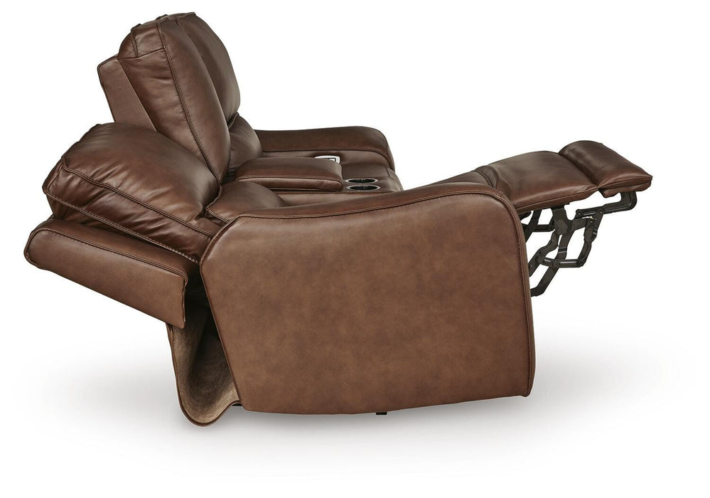 Ashley Furniture DeepWakes power reclining loveseat with console, featuring plush upholstery and side view in a modern living room setting.