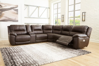 Ashley Furniture Dunleith Power Reclining Sectional with plush cushions and reclining seats in a neutral fabric.