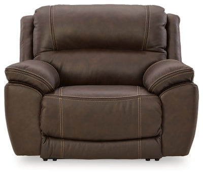 Ashley Furniture Dunleith Power Recliner in dark upholstery, showing a close-up of the headrest and recline mechanism.
