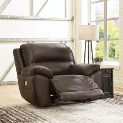 Open Ashley Furniture Dunleith Power Recliner showing plush cushioned seating and reclining mechanism in a modern living room setting.