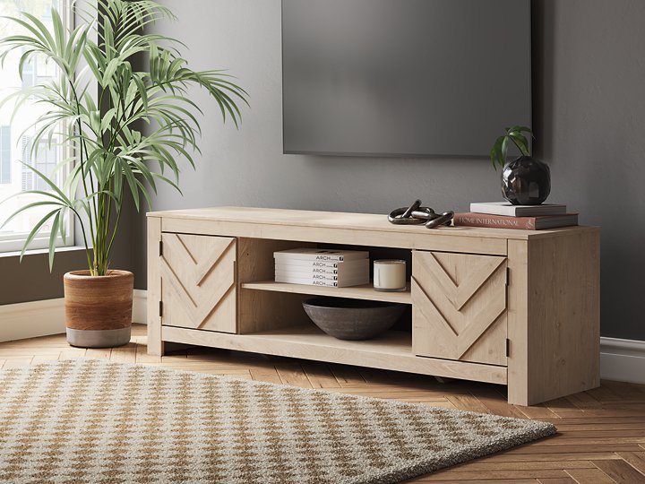 Ashley Furniture Cayboni 71-inch TV stand, modern entertainment center with storage compartments, in a sleek wood finish.